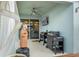 Outdoor patio with a barbecue grill, TV, and adjacent cozy seating area, ideal for outdoor enjoyment at 582 8Th Nw St, Ruskin, FL 33570