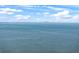 View of the water with a boat and the city skyline on the horizon at 582 8Th Nw St, Ruskin, FL 33570