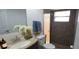 Bathroom featuring a granite countertop, modern sink, vanity, mirror, and tile shower at 7024 Coral Reef Dr, Port Richey, FL 34668