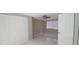 Bedroom with tile floors, window, ceiling fan, and large closet with sliding doors at 7024 Coral Reef Dr, Port Richey, FL 34668