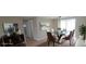 Virtually staged dining room with modern table, chairs and buffet at 7024 Coral Reef Dr, Port Richey, FL 34668
