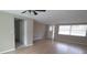 Open-concept living room featuring hardwood flooring, neutral paint, and lots of natural light at 7024 Coral Reef Dr, Port Richey, FL 34668
