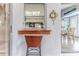 A kitchen passthrough to a bar area featuring a wicker bar stool and views into the adjacent dining room at 7107 Pond View Ct, Spring Hill, FL 34606