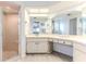 Bright bathroom with a glass-enclosed shower, and large vanity with ample counter space at 7107 Pond View Ct, Spring Hill, FL 34606