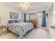Bright bedroom featuring stylish decor, a ceiling fan, and ample natural light from the windows at 7107 Pond View Ct, Spring Hill, FL 34606