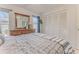Bright bedroom featuring a large closet, window, dresser with a mirror, and modern stylish decor at 7107 Pond View Ct, Spring Hill, FL 34606