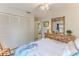 Bright bedroom featuring ample closet space, and stylish decor at 7107 Pond View Ct, Spring Hill, FL 34606