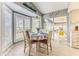 Inviting dining area with bay window and sliding glass doors leading to an outdoor space at 7107 Pond View Ct, Spring Hill, FL 34606