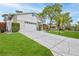 Lovely exterior with an attached garage and a wide patterned driveway at 7107 Pond View Ct, Spring Hill, FL 34606