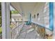 Covered front porch with stone accents, seating, and decorative accessories at 7107 Pond View Ct, Spring Hill, FL 34606
