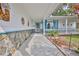 Inviting front porch featuring stone accents, decorative touches, and a cozy entrance at 7107 Pond View Ct, Spring Hill, FL 34606