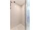 Modern shower stall with tiled walls and flooring at 7107 Pond View Ct, Spring Hill, FL 34606