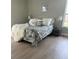 Cozy bedroom with plush bedding, neutral walls, and a large window at 7336 Ivory Ter, New Port Richey, FL 34655