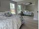 A well-lit bedroom with a full length mirror for a more open feel to the room at 7336 Ivory Ter, New Port Richey, FL 34655