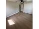 Bright bedroom features a large closet, modern ceiling fan, and neutral walls at 7336 Ivory Ter, New Port Richey, FL 34655