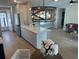 Open-concept kitchen with an island, stainless steel appliances, and hardwood floors at 7336 Ivory Ter, New Port Richey, FL 34655