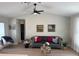 Inviting living room with vaulted ceilings, ceiling fan, and contemporary decor at 7336 Ivory Ter, New Port Richey, FL 34655