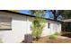 Exterior back view with small tree and AC unit at 807 S Castle Ct, Tampa, FL 33612