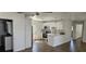 Bright kitchen features stainless appliances, stylish backsplash, and modern white cabinets at 807 S Castle Ct, Tampa, FL 33612