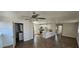 This open kitchen features stainless appliances, stylish backsplash, and modern white cabinets at 807 S Castle Ct, Tampa, FL 33612
