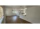 Bright living room featuring a ceiling fan, window, and open access to an updated kitchen at 807 S Castle Ct, Tampa, FL 33612