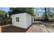 Exterior view of outbuilding featuring a white exterior and a window at 807 S Castle Ct, Tampa, FL 33612