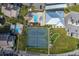 Aerial view showcasing community amenities including pools, tennis courts, putting green, and clubhouse for active living at 8251 Brent St # 918, Port Richey, FL 34668