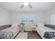 Bright bedroom with twin beds, side tables, and beautiful ocean view at 8251 Brent St # 918, Port Richey, FL 34668