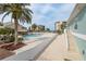 Inviting community pool and clubhouse with lush landscaping and comfortable lounging areas, perfect for relaxation at 8251 Brent St # 918, Port Richey, FL 34668