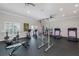 On-site gym features modern equipment for cardio and strength training, plus large windows for natural light at 8251 Brent St # 918, Port Richey, FL 34668