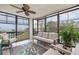 Enclosed lanai featuring comfortable seating and sweeping water views at 8251 Brent St # 918, Port Richey, FL 34668