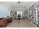A quiet library space, complete with bookshelves, comfortable seating, and a desk for a relaxing reading environment at 8251 Brent St # 918, Port Richey, FL 34668
