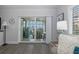 View of the screened patio area from the living room, showcasing ocean views at 8251 Brent St # 918, Port Richey, FL 34668