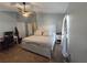 Large main bedroom with ceiling fan, neutral decor and a comfortable bed at 8405 Blue Rock Dr, New Port Richey, FL 34653