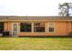 The backyard has well-maintained green grass and a sliding glass door at 9321 Whitstone Ct, New Port Richey, FL 34655