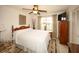 This bedroom has a ceiling fan and a large window at 9321 Whitstone Ct, New Port Richey, FL 34655