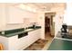 Efficient kitchen featuring ample counter space and white cabinets, perfect for meal preparation at 9321 Whitstone Ct, New Port Richey, FL 34655