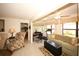 Open living room featuring a bedroom, office area, and seamless flow for modern living at 9321 Whitstone Ct, New Port Richey, FL 34655