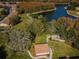Aerial view of community with walking path, gazebo, and lush green spaces at 9336 Cape Charles Ave, New Port Richey, FL 34655