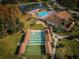 Aerial view of community pool, shuffleboard, and recreation area at 9336 Cape Charles Ave, New Port Richey, FL 34655