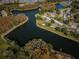 Breathtaking aerial view of the community featuring lush landscaping and tranquil water features at 9336 Cape Charles Ave, New Port Richey, FL 34655