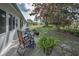 Enjoy the backyard patio chairs, potted plants, and a flowering tree for a tranquil outdoor retreat at 9336 Cape Charles Ave, New Port Richey, FL 34655