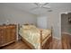 Bedroom featuring hard wood floors, a ceiling fan, and dresser at 9336 Cape Charles Ave, New Port Richey, FL 34655
