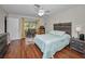 Comfortable bedroom with sliding glass doors to outdoor screened patio area at 9336 Cape Charles Ave, New Port Richey, FL 34655