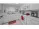 Functional kitchen with white cabinetry, ample counter space, and standard appliances at 9336 Cape Charles Ave, New Port Richey, FL 34655