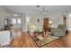 Inviting living room with wood floors, cozy seating, and a decorative area rug at 9336 Cape Charles Ave, New Port Richey, FL 34655