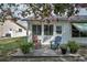 Cozy patio with comfortable chairs, potted plants, and views of the home, perfect for outdoor relaxation at 9336 Cape Charles Ave, New Port Richey, FL 34655