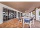 Covered patio area with tables and chairs, perfect for outdoor dining and relaxation at 9336 Cape Charles Ave, New Port Richey, FL 34655