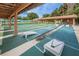 Recreational area showcasing shuffleboard courts under covered patios for outdoor enjoyment at 9336 Cape Charles Ave, New Port Richey, FL 34655