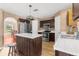 Kitchen featuring stainless steel appliances, wood cabinets, a tiled island, and a bright view of the backyard at 10399 Elgin Blvd, Spring Hill, FL 34608